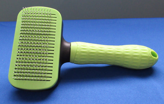 Green brush with button for easy cleaning