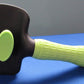 Green brush showing button used for easy hair removal